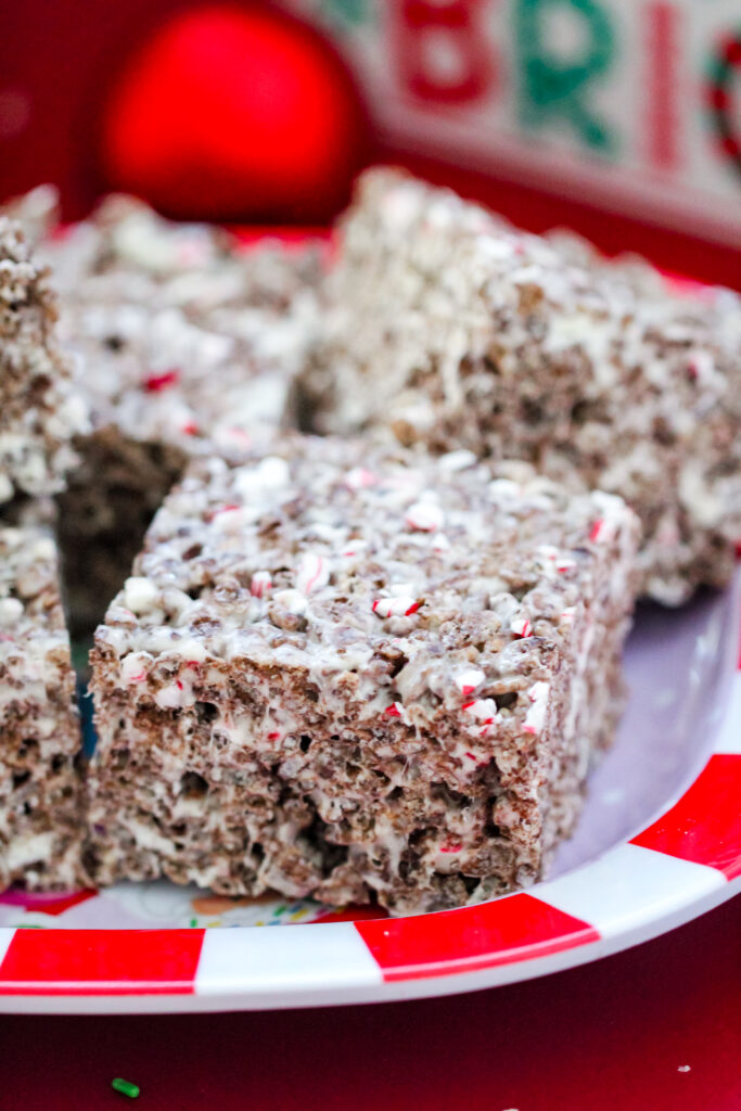 Cocoa Candy Cane Krispies Treats — chocolate rice krispie treats mixed with marshmallows and crushed candy canes for a fun Christmas dessert.