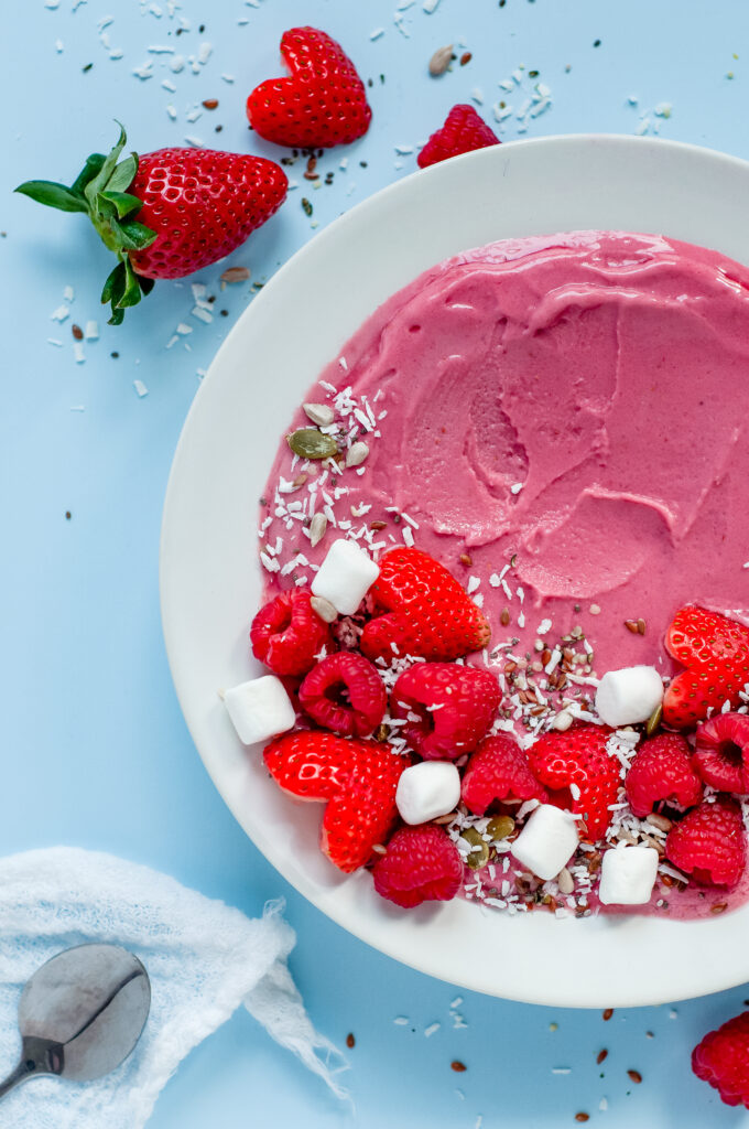 View of Strawberry Cream Bowl with strawberries, marshmallows, raspberries, and sprinkles.