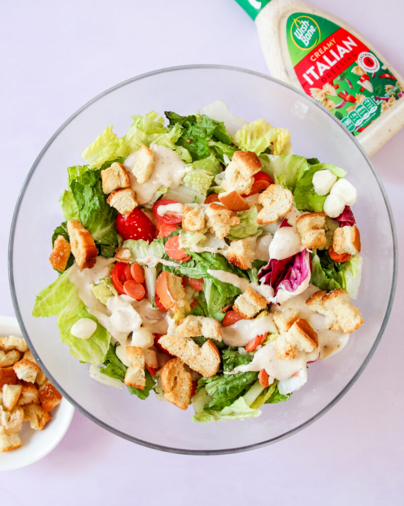 Fresh pizza-inspired salad with pepperoni, mozzarella, and crisp greens.