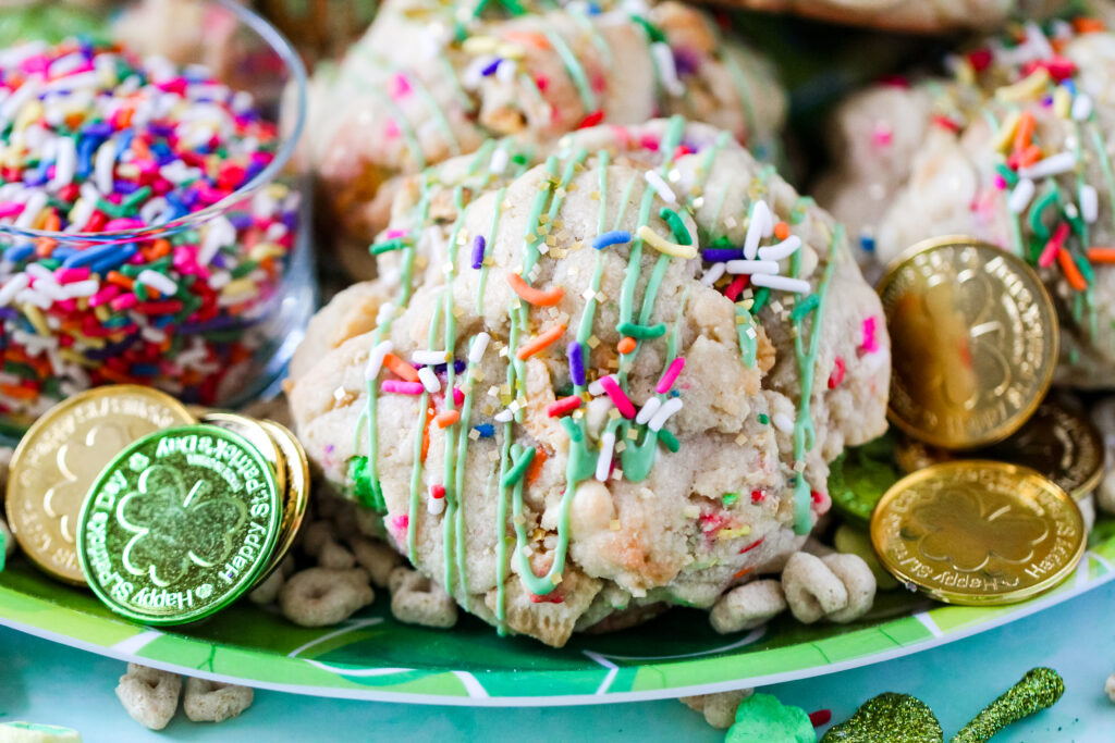 Jumbo bakery-style cookie with white chocolate chips, Lucky Charms cereal, and festive sprinkles.