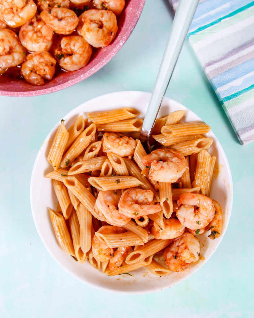 Garlic shrimp cooked in butter and topped with Hawaiian red sea salt, served in a skillet with fresh parsley.