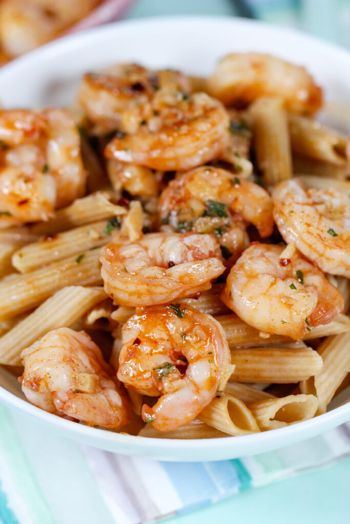 Garlic shrimp cooked in butter and topped with Hawaiian red sea salt, served in a skillet with fresh parsley.