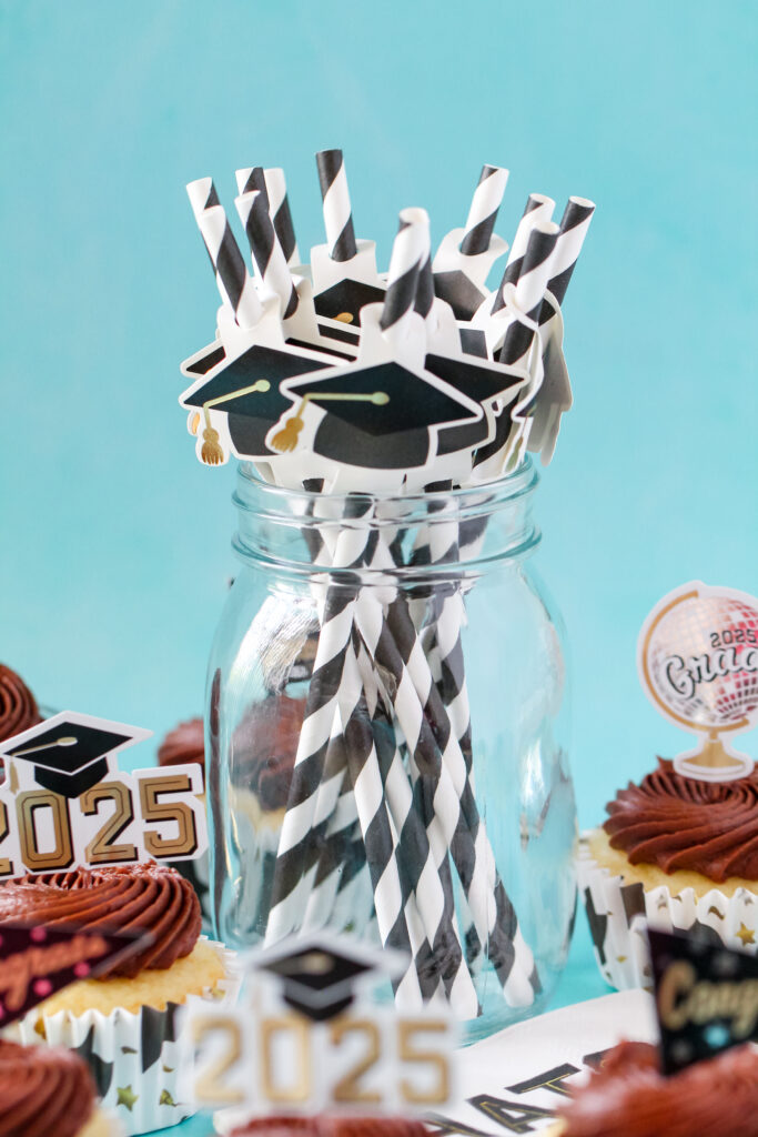 Chocolate almond cupcakes topped with swirled Nutella frosting and mini chocolate chips, perfect for graduation celebrations.