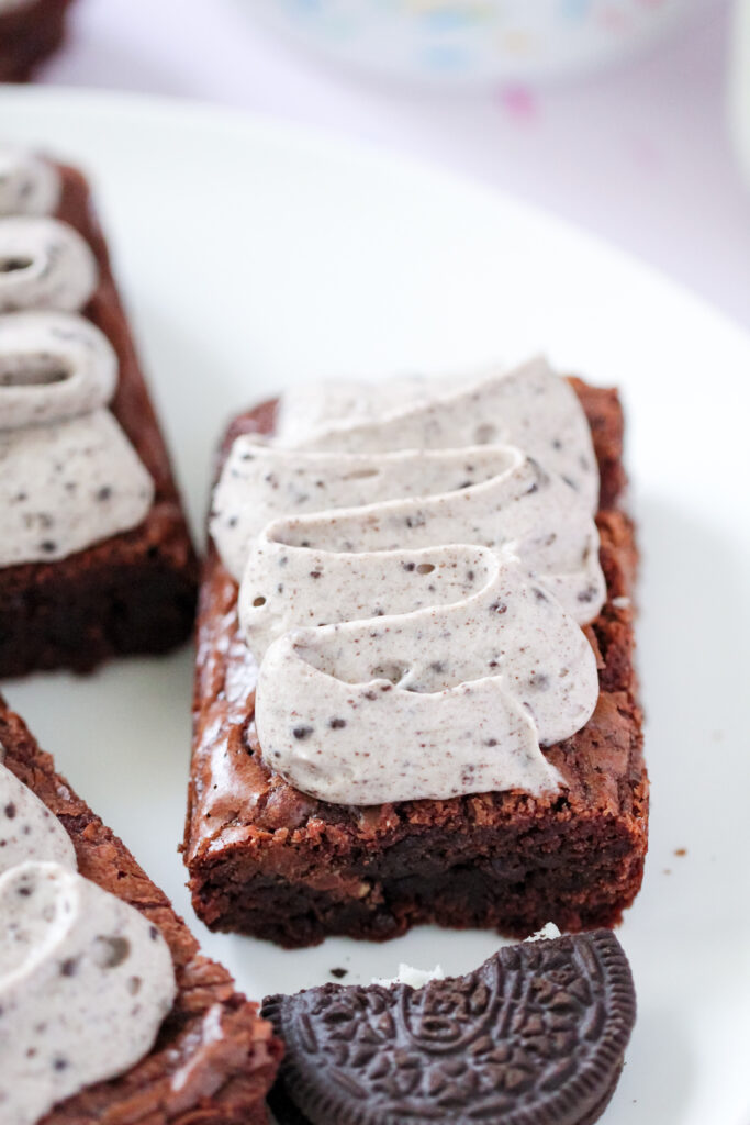 A close up of Toblerone Crunch Brownie Bars with Whipped Oreo Frosting.