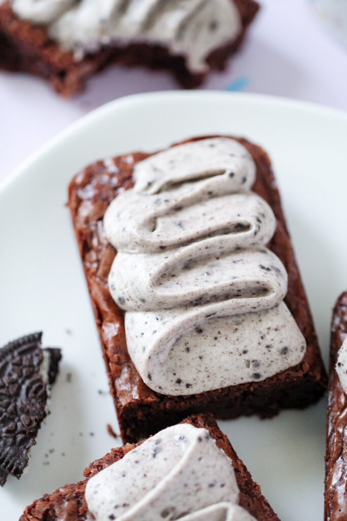 A close up of Toblerone Crunch Brownie Bars with Whipped Oreo Frosting.