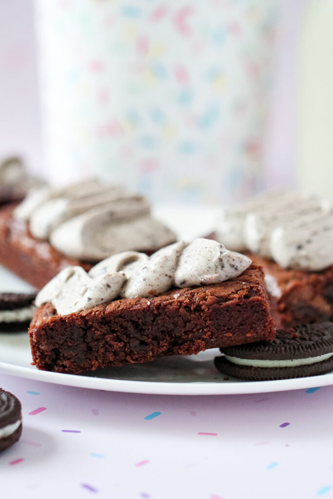 A side view of Toblerone Crunch Brownie Bars with Whipped Oreo Frosting.