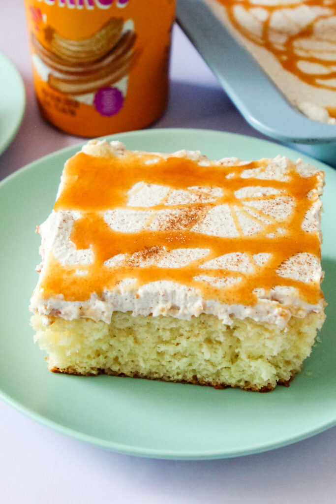 A slice of Churro Cream Poke Cake.
