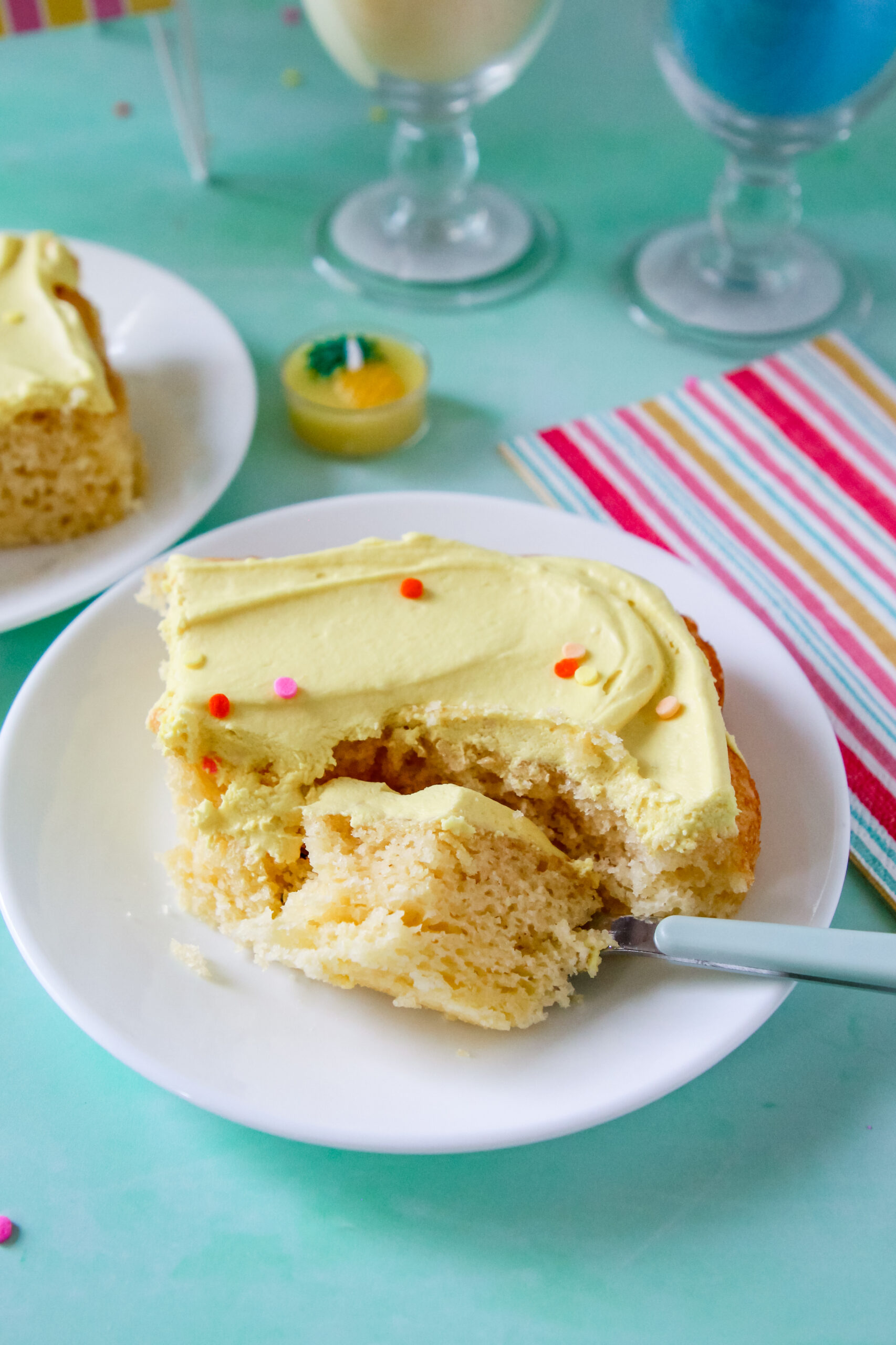 A slice of Pineapple Party Sheet Cake.
