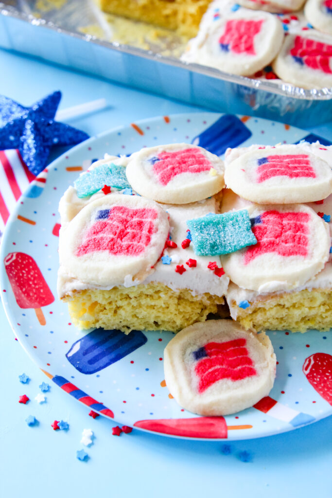 A picture of two slices of Lemon Cookie Patriotic Party Cake.