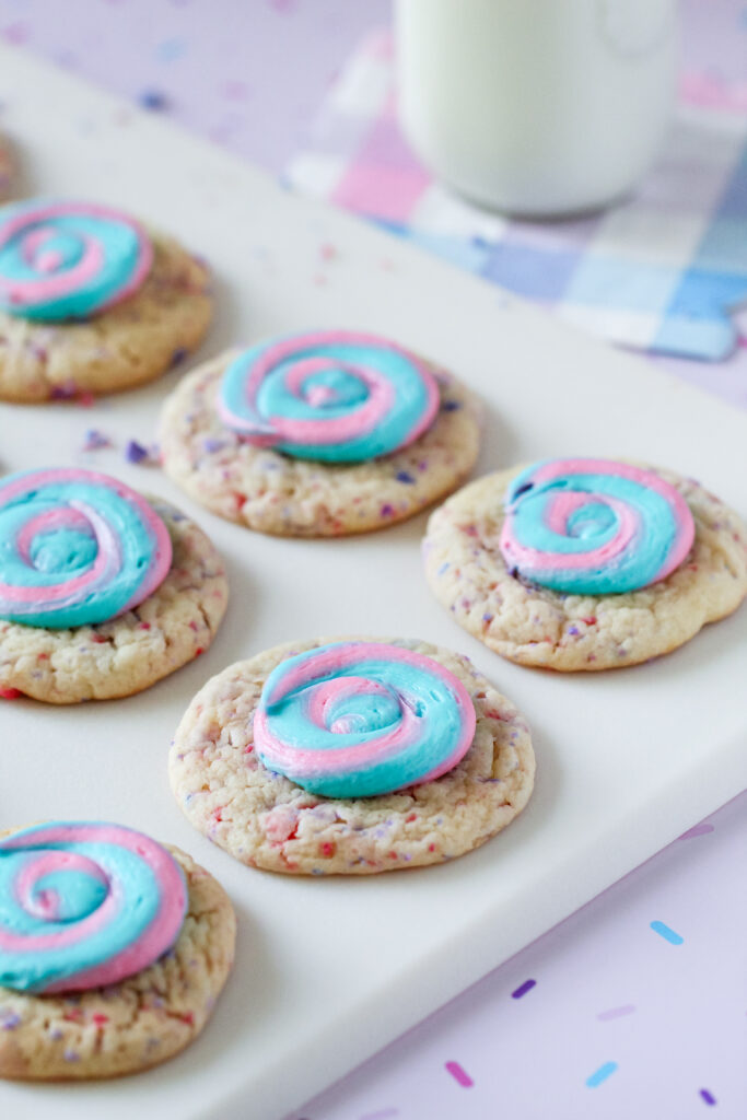 Picture of cotton candy swirl cookies with blue and pink frosting.