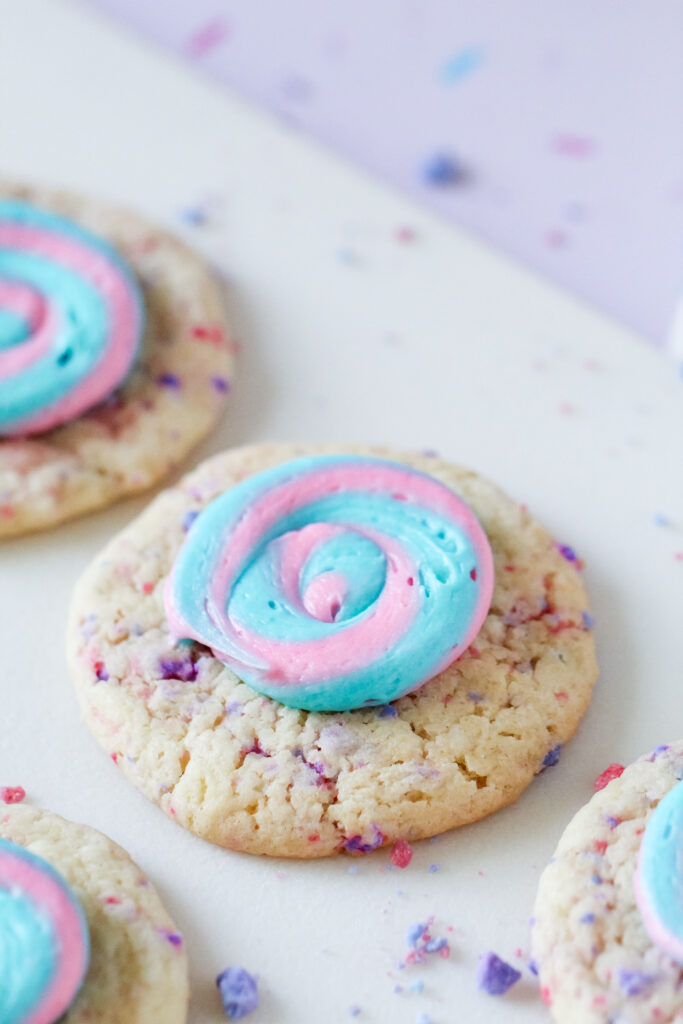 Picture of cotton candy swirl cookies with blue and pink frosting.