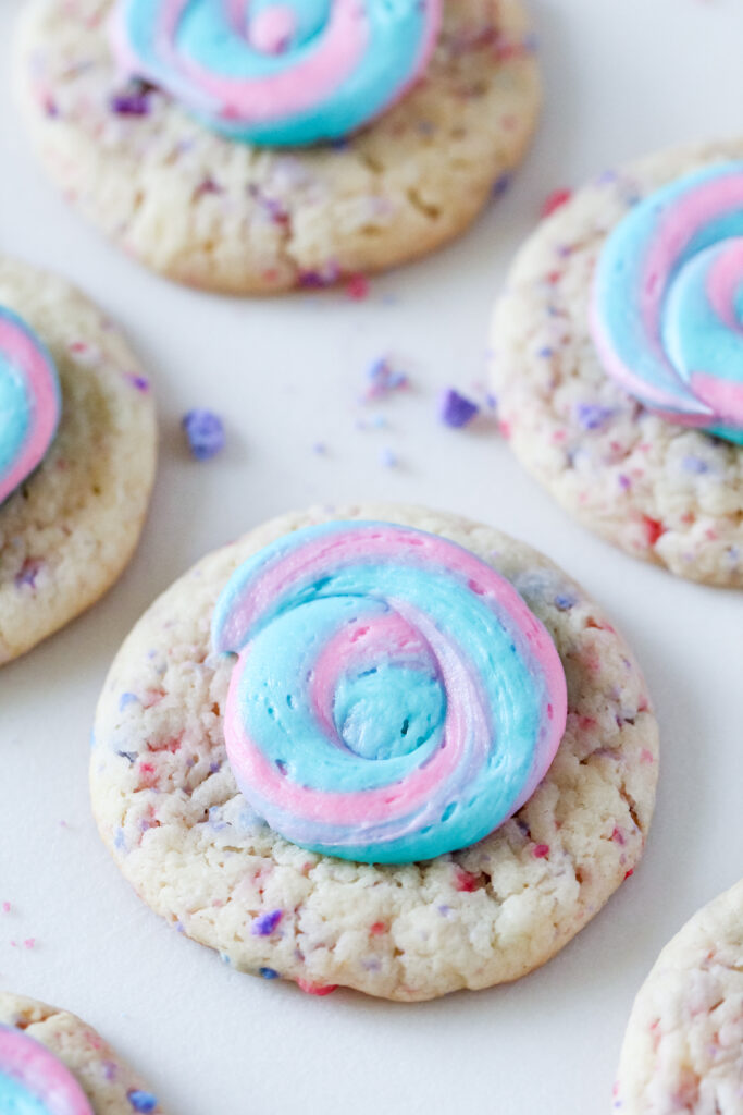 Picture of cotton candy swirl cookies with blue and pink frosting.