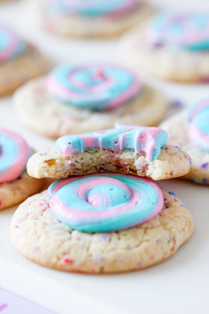 Picture of cotton candy swirl cookies with blue and pink frosting.