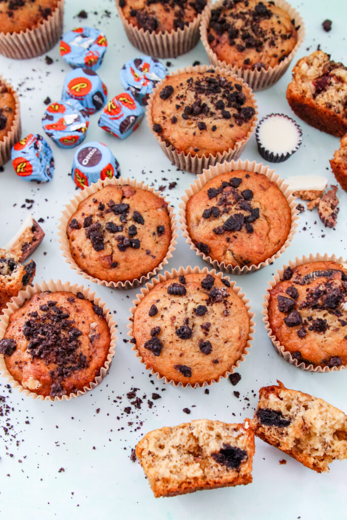 Banana Butter Cup Crunch Muffins: moist banana muffins studded with peanut butter cup chunks and Oreo crumbs