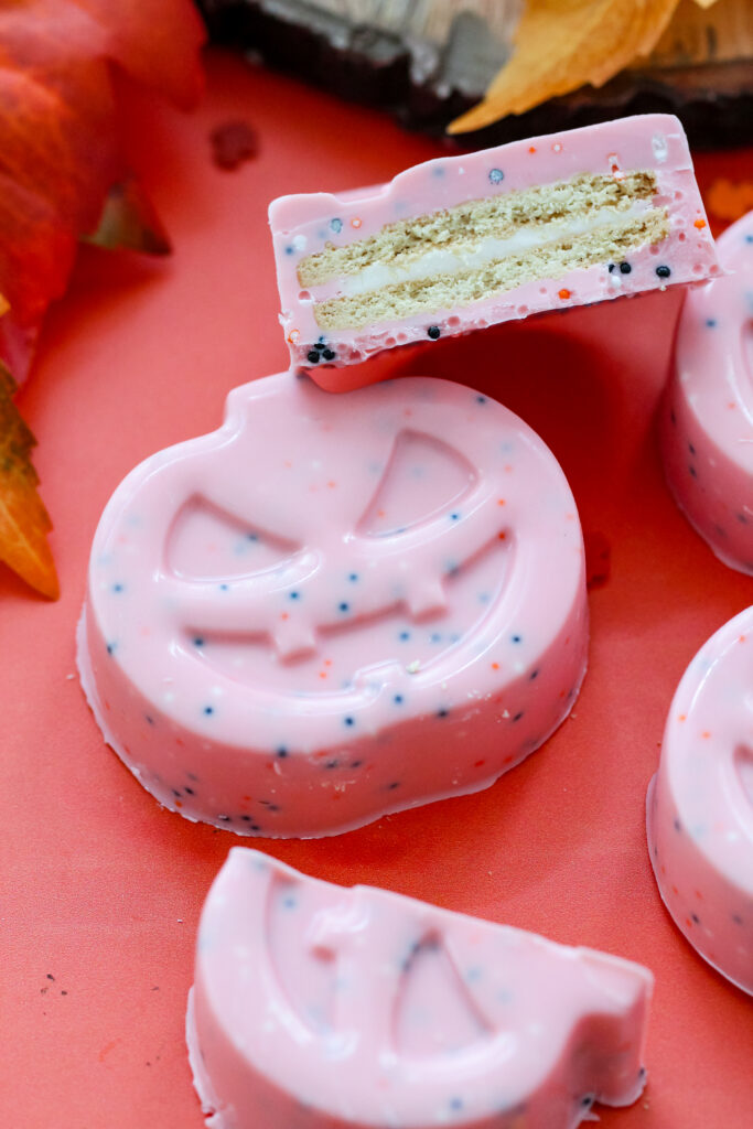Image of the inside of a Sprinkled Pink Pumpkin Covered Cookies perfect for Halloween.