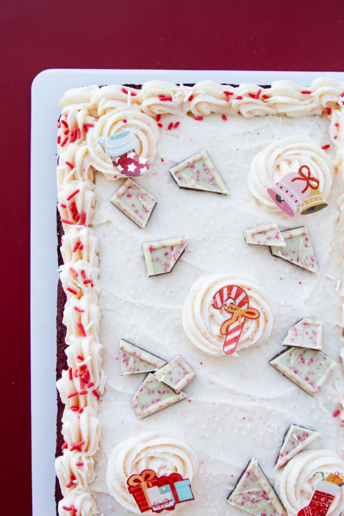 Red Velvet Candy Cane Cake with white buttercream, peppermint sprinkles, and candy toppings — an easy festive dessert for Christmas.