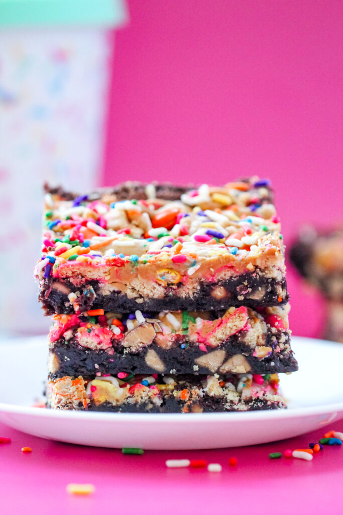 Peanut Butter Party Brownies with Reese's chopped in and rainbow sprinkles on top. 