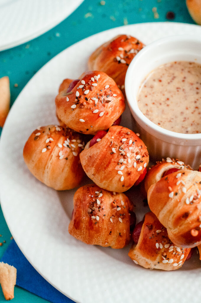 Hot dogs wrapped in crescent rolls with everything bagel seasoning.